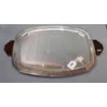 An Art Deco shaped rectangular plated tray with stepped wooden handles length 58cm