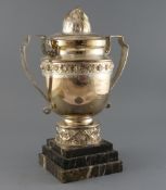 An ornate French silver plated racing two handled trophy cup and cover, inscribed 'Rallye Feminin