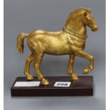 After Giambologna. A gilt metal model of a horse height 17cm