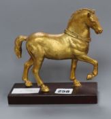 After Giambologna. A gilt metal model of a horse height 17cm