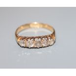 A George V 18ct gold and five stone diamond half hoop ring, size N/O.
