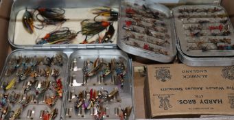 A collection of vintage Hardy's fishing flies in Hardy tins and loose including nine large flies,