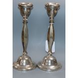 A pair of George V silver candlesticks, Birmingham, 1925, weighted, 24.1cm.