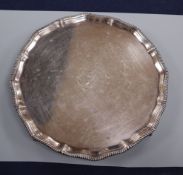 A Victorian silver salver with gadrooned edge, monogrammed, London 1894, makers Goldsmiths &