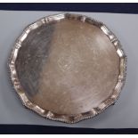 A Victorian silver salver with gadrooned edge, monogrammed, London 1894, makers Goldsmiths &