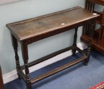 A 17th century and later oak table W.96cm