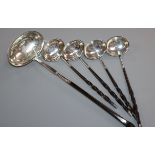 Four George III small silver toddy ladles with whalebone handles and a similar larger ladle (
