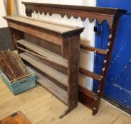 Two 18th century oak plate racks larger W.182cm