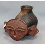 An African Congo Pende Tribe mask together with a pottery vase