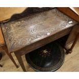 A late 19th century carved oak side table W.90cm