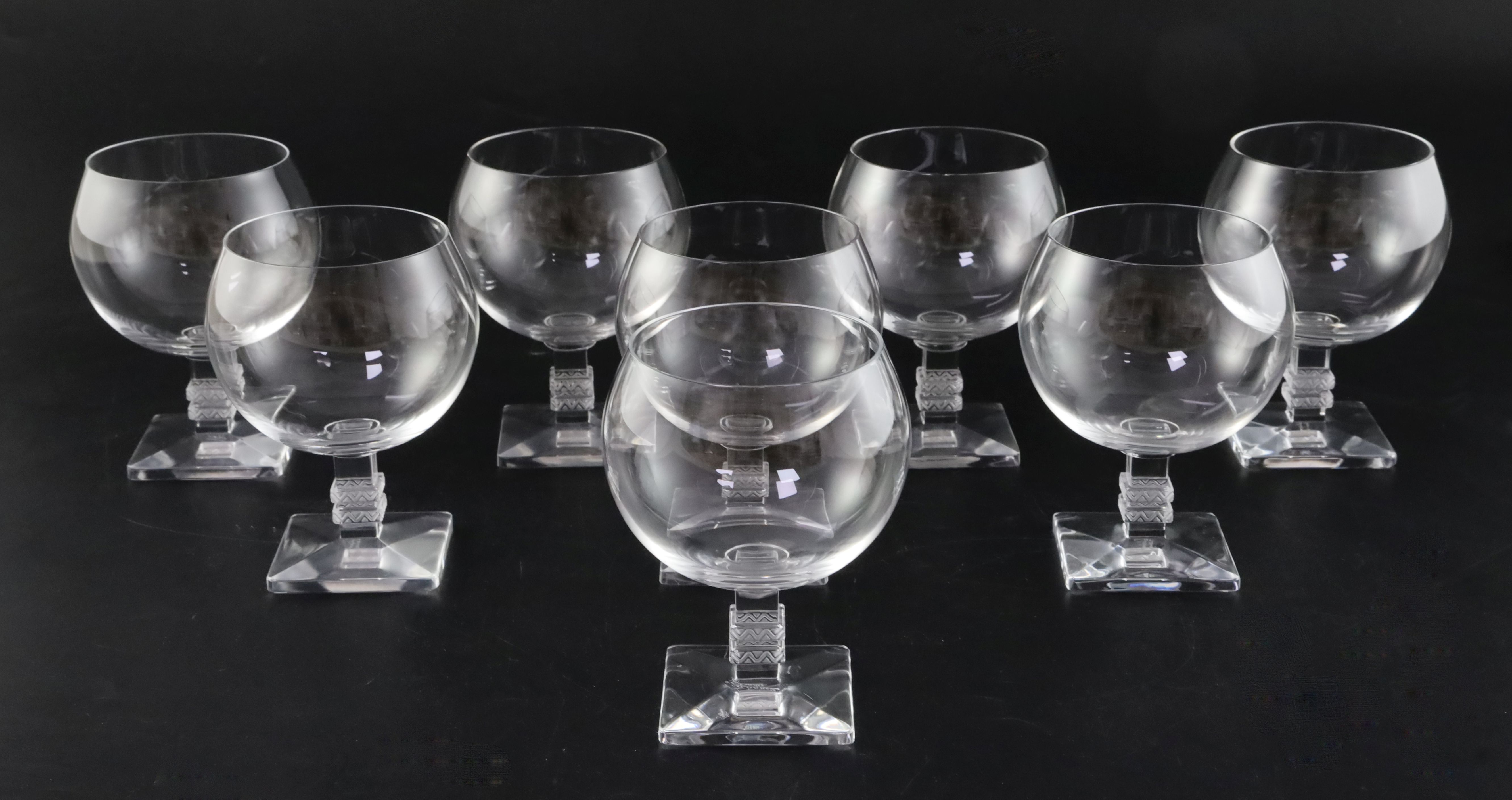 A set of eight Lalique 'Argos' pattern wine glasses, each on square stepped stem with moulded