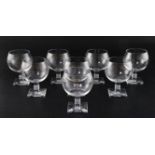 A set of eight Lalique 'Argos' pattern wine glasses, each on square stepped stem with moulded
