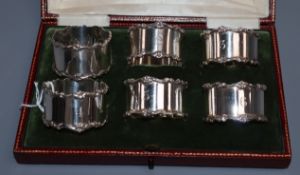 A cased set of six George V silver napkin rings, Elkington & Co, Birmingham, 1913, (numbered 1-6).