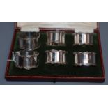 A cased set of six George V silver napkin rings, Elkington & Co, Birmingham, 1913, (numbered 1-6).