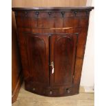 A George III mahogany hanging corner cabinet W.86cm