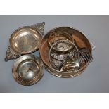 A silver bottle coaster, silver tea strainer and pin dish, four silver spirit labels, a plated label