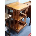 An Edwardian Maple & Co walnut revolving bookcase W.49cm