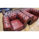Two leather oxblood leather chesterfield armchairs W.106cm