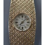A lady's 1960's 9ct Omega manual back wind bracelet watch, approx. 17cm.
