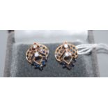 A pair of diamond and gem-set yellow metal openwork earrings (test as 18ct).