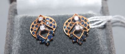 A pair of diamond and gem-set yellow metal openwork earrings (test as 18ct).