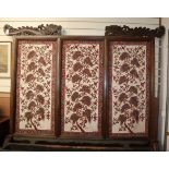 A large 19th century Javanese teak screen with Batik panels by Pamang 59cm