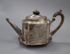 A George III bright cut silver teapot of shaped oval form, London 1815, maker Solomon Hougham,