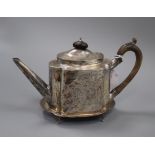 A George III bright cut silver teapot of shaped oval form, London 1815, maker Solomon Hougham,