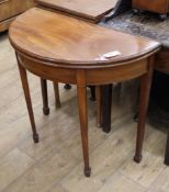 A George III style inlaid mahogany 'D' shaped folding tea table W.80cm