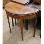 A George III style inlaid mahogany 'D' shaped folding tea table W.80cm