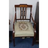 A pair of Edwardian marquetry inlaid mahogany elbow chairs
