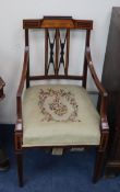 A pair of Edwardian marquetry inlaid mahogany elbow chairs