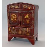 A Japanese lacquered cabinet, with key height 34cm