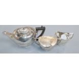 A George V demi fluted silver three piece tea set, Mappin & Webb, Sheffield, 1918/9, gross 22.5 oz.