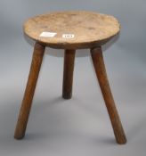 A 19th century elm stool height 37cm