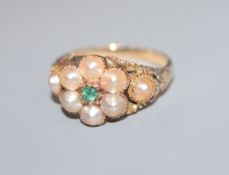 A late Victorian yellow metal, split pearl and emerald cluster dress ring, size K/L.