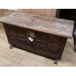 A 17th century style oak coffer W.108cm