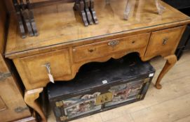 A 1920's Queen Anne style figured walnut kneehole dressing table W.122cm