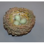 A Bristol porcelain model of a bird's nest, modelled by Edward Raby for Pountney & Co, in moss