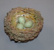 A Bristol porcelain model of a bird's nest, modelled by Edward Raby for Pountney & Co, in moss