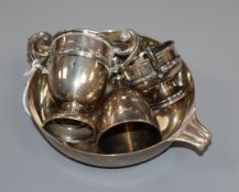 A silver quaich and three small silver trophy cups.