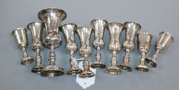 Eleven assorted silver kiddush cups, tallest 13.2cm.