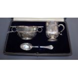 A cased matched George V silver three piece christening set, Goldsmiths & Silversmiths Co Ltd,