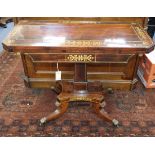 A Regency rosewood card table inlaid with cut brass-work, on square pillar and quadripartite base (