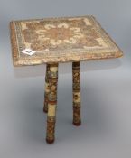 A 19th century Kashmiri painted wood tripod table height 36cmProvenance - from the family of a