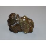 A Chinese carved jade figure of a lion dog with hawk height 5cm