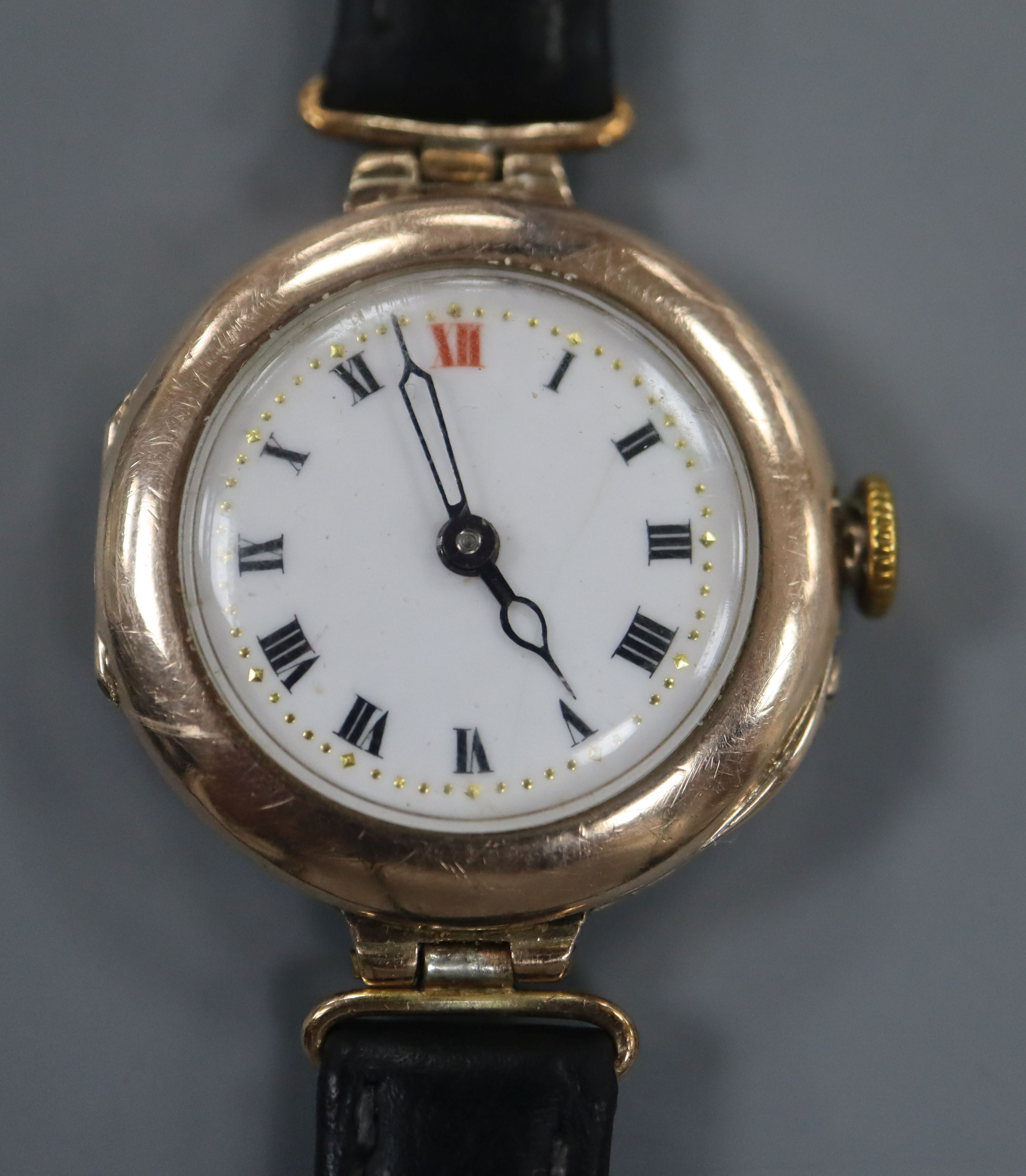 A lady's early 20th century 9ct gold manual wind wrist watch, on associated black leather strap.