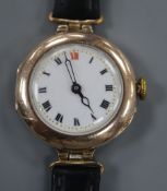 A lady's early 20th century 9ct gold manual wind wrist watch, on associated black leather strap.