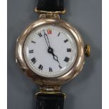 A lady's early 20th century 9ct gold manual wind wrist watch, on associated black leather strap.
