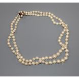 A double strand cultured pearl choker necklace with 9ct gem set clasp, 35cm.